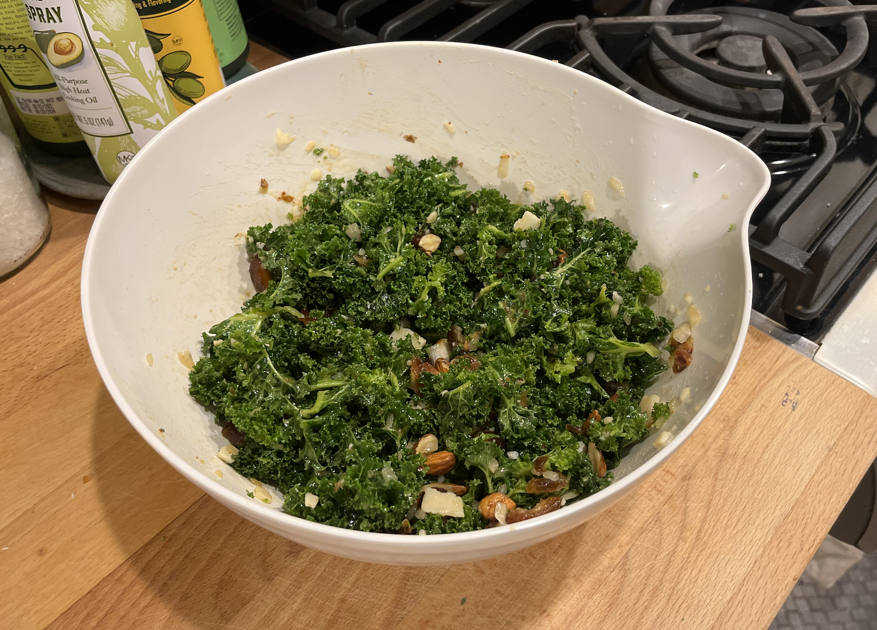 a bowl of the epicurious kale and date and parmesan salad with almonds